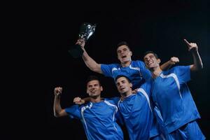 calciatori che celebrano la vittoria foto