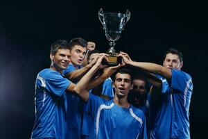 calciatori che celebrano la vittoria foto