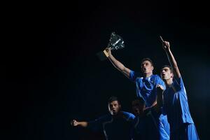 calciatori che celebrano la vittoria foto