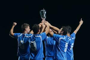 calciatori che celebrano la vittoria foto