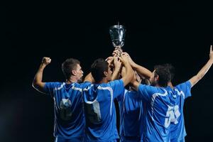 calciatori che celebrano la vittoria foto