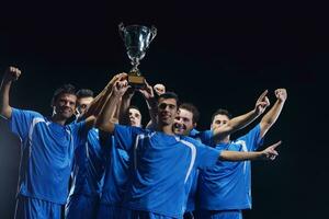 calciatori che celebrano la vittoria foto