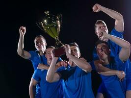 calciatori che celebrano la vittoria foto