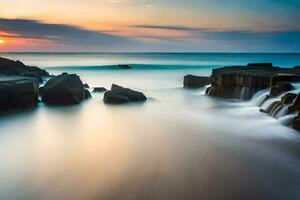 un' lungo esposizione fotografia di rocce e acqua a tramonto. ai-generato foto