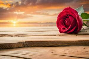 un' singolo rosso rosa si siede su un' di legno tavolo nel davanti di il tramonto. ai-generato foto