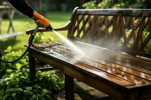 estate all'aperto pulizia persona usi pressione rondella su di legno giardino panchina ai generato foto