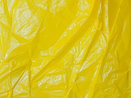 vicino su giallo plastica struttura sfondo foto