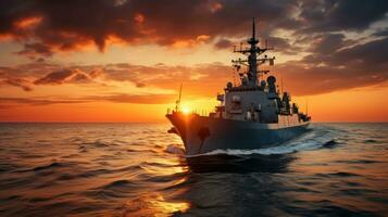 tramonto al di sopra di un' Marina Militare nave su il Aperto mare foto