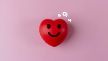 rosso cuore con smiley viso e sociale media icone su rosa sfondo foto