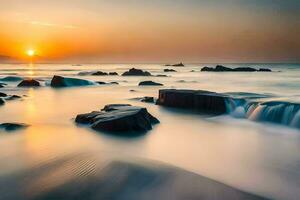 un' bellissimo tramonto al di sopra di il oceano con rocce e acqua. ai-generato foto