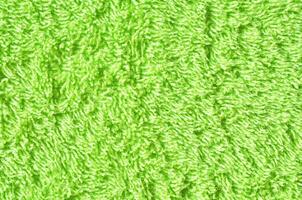 morbido verde struttura di asciugamano. verde asciugamano struttura. cotone asciugamano sfondo e struttura foto