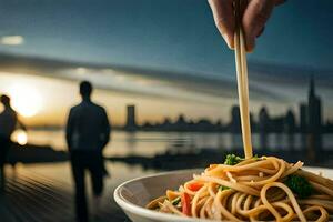 un' persona Tenere bastoncini al di sopra di un' ciotola di tagliatelle. ai-generato foto