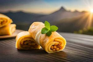 tre rotoli di cibo con un' montagna nel il sfondo. ai-generato foto