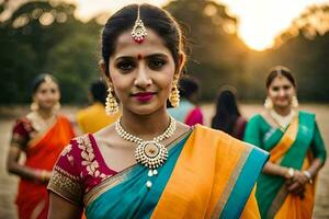 un' donna nel un' colorato sari in piedi nel davanti di altro donne. ai-generato foto