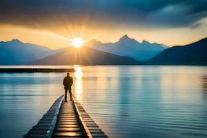 un' uomo in piedi su un' molo guardare a il sole ambientazione al di sopra di montagne. ai-generato foto