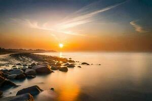 il sole sorge al di sopra di il oceano e rocce su il costa. ai-generato foto