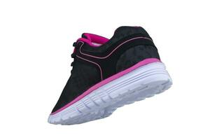 nero scarpe da ginnastica con rosa Accenti su un' bianca suola. sport scarpe su un' bianca sfondo. foto