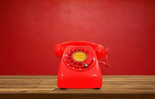 rosso Vintage ▾ telefono su di legno tavolo con rosso sfondo foto
