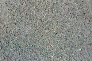 grigio vulcanico sabbia, piccolo pietra superficie. dettagliato naturale sfondo o struttura foto
