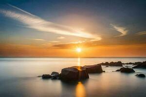 il sole imposta al di sopra di il oceano e rocce. ai-generato foto