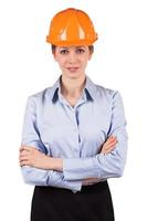 donna con un casco protettivo arancione foto
