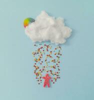 creativo nube con colorato spruzzatori e gommoso caramella. minimo concetto sfondo. foto