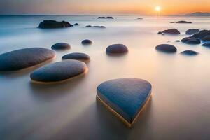 un' cuore sagomato roccia è seduta su il spiaggia a tramonto. ai-generato foto