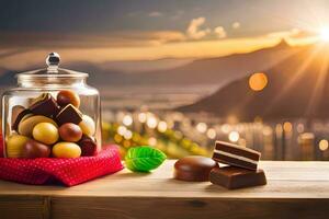 cioccolatini e caramelle nel un' bicchiere vaso su un' tavolo con un' Visualizza di il montagne. ai-generato foto