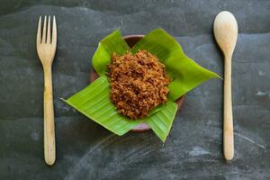 abon fatto di carne, tritato carne piatti fatto con Marrone zucchero e essiccato, conservato Alimenti. indonesiano asiatico cibo foto