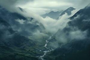 un' valle con nuvole e montagne foto