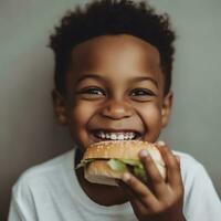 Sandwich giorno. ai generato. un' Nero, allegro ragazzo detiene un' grande Sandwich nel il suo mani. avvicinamento. veloce cibo. malsano cibo foto