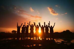 lavoro di squadra nel silhouette mani sollevato alto, unito nel celebrazione ai generato foto