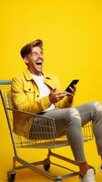 eccitato uomo ridendo e utilizzando smartphone nel shopping carrello carrello su giallo sfondo ai generato foto