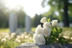 bianca fiori nel davanti di un' pietra sepolcrale a un' cimitero con tramonto.funerale concetto ai generato foto