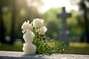 bianca fiori nel davanti di un' pietra sepolcrale a un' cimitero con tramonto.funerale concetto ai generato foto