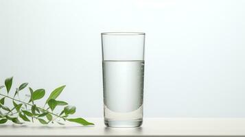 bicchiere di acqua su il tavolo con verde pianta su bianca sfondo. ai generato foto