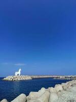 faro rosso cavallo bianca io tewoo jeju isola foto