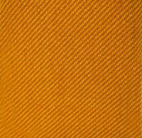 giallo carbonio tessuto Materiale struttura e tessile sfondo. foto