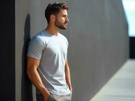attraente uomo indossare vuoto vuoto grigio maglietta modello per design modello, ai generato foto