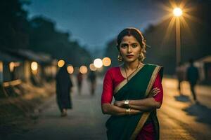 un' donna nel un' rosso sari in piedi su il strada a notte. ai-generato foto