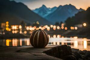 un' palla si siede su il bordo di un' lago a notte. ai-generato foto