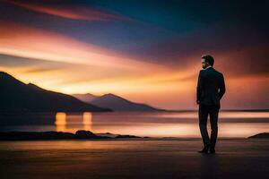 un' uomo nel un' completo da uomo sta su il spiaggia a tramonto. ai-generato foto