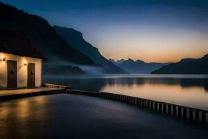 un' piccolo Casa si siede su il bordo di un' lago a crepuscolo. ai-generato foto