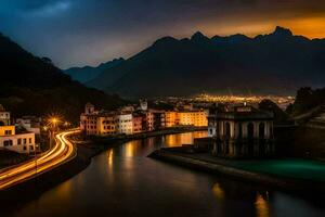 un' fiume corre attraverso un' cittadina a notte con montagne nel il sfondo. ai-generato foto