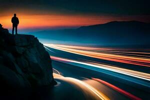 un' uomo sta su un' scogliera prospiciente un' strada a tramonto. ai-generato foto