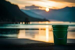 un' verde secchio si siede su il spiaggia a tramonto. ai-generato foto