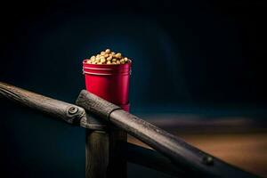 un' rosso secchio con Popcorn su superiore di un' di legno ringhiera. ai-generato foto