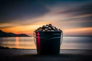 un' secchio di noccioline su il spiaggia a tramonto. ai-generato foto