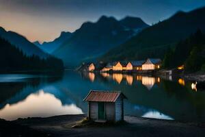 un' piccolo cabina si siede su il riva di un' lago a crepuscolo. ai-generato foto