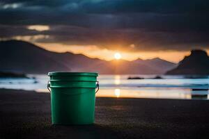 un' verde secchio su il spiaggia a tramonto. ai-generato foto